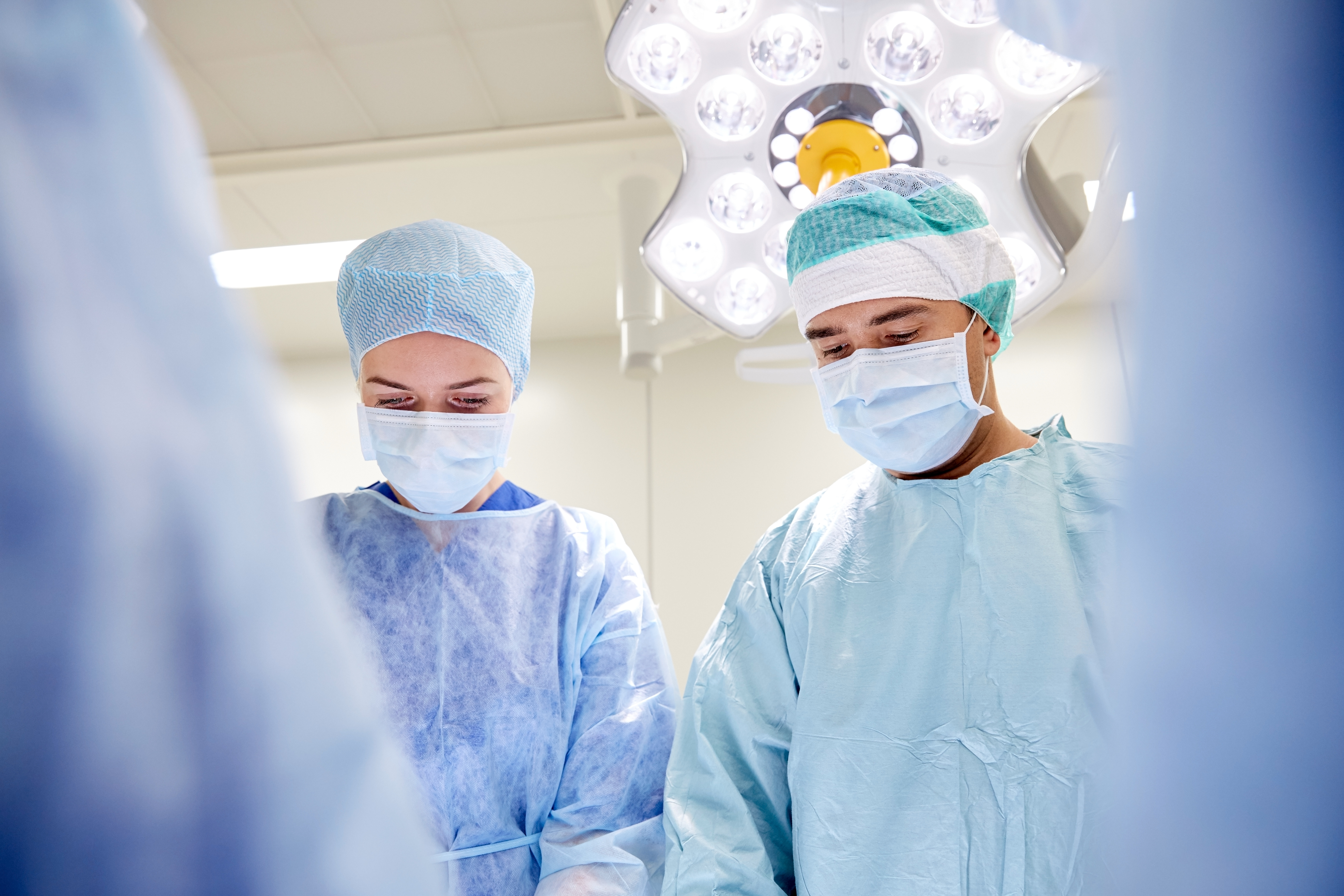 A group of ER doctors smiling happily
